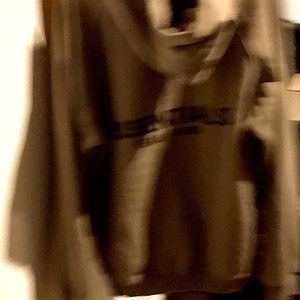 COPY - Tan hoody that says Essentials on the back of it